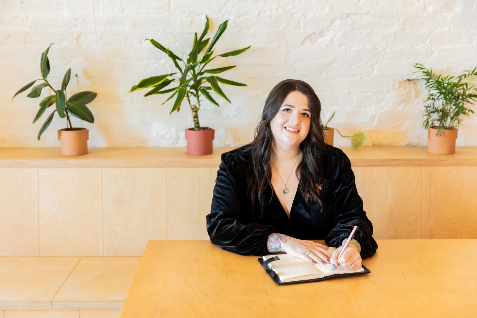 Hannah Wild smiling in her counselling space